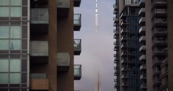 CN Tower can be seen behind condos in Toronto's Liberty Village