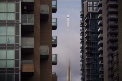 CN Tower can be seen behind condos in Toronto's Liberty Village