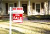 For sale sign with price reduced