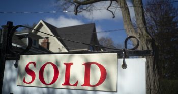 A real estate sold sign is shown in a Toronto west end neighbourhood May 16, 2020. THE CANADIAN PRESS/Graeme Roy